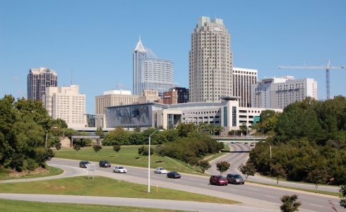 Cityscape of downtown Raleigh, North Carolina from a highway overpass.