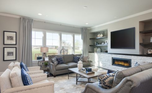 Model family room with TV in Willoughby community.