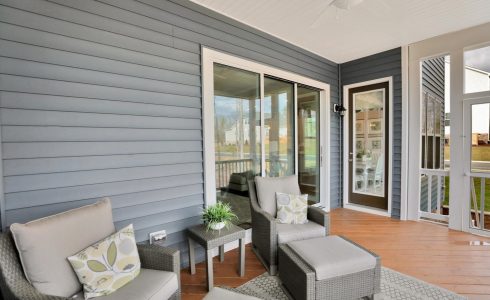 covered deck porch furniture grey siding